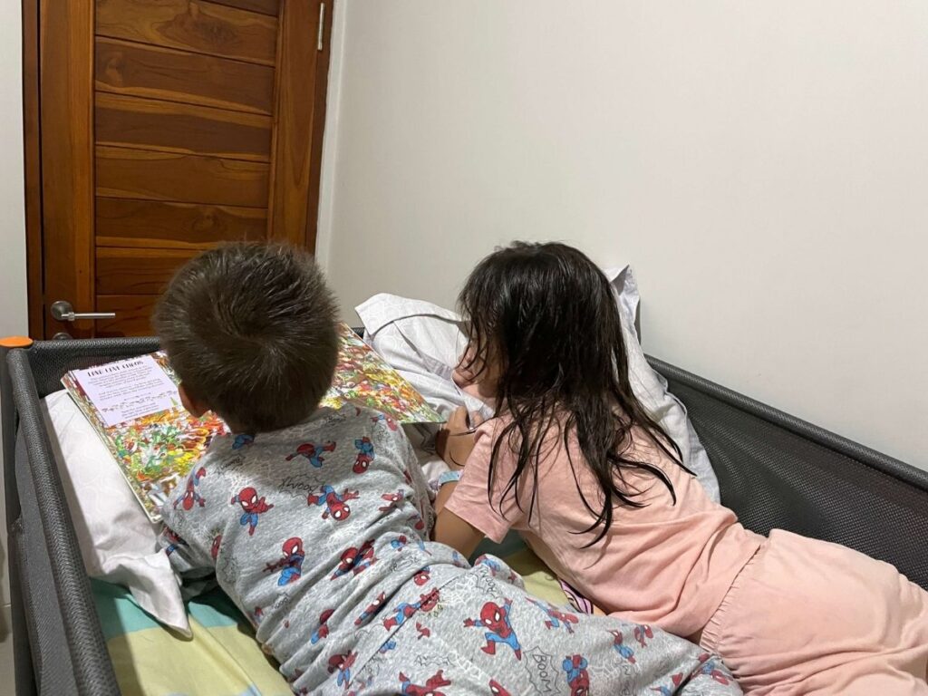 Children reading at bedtime